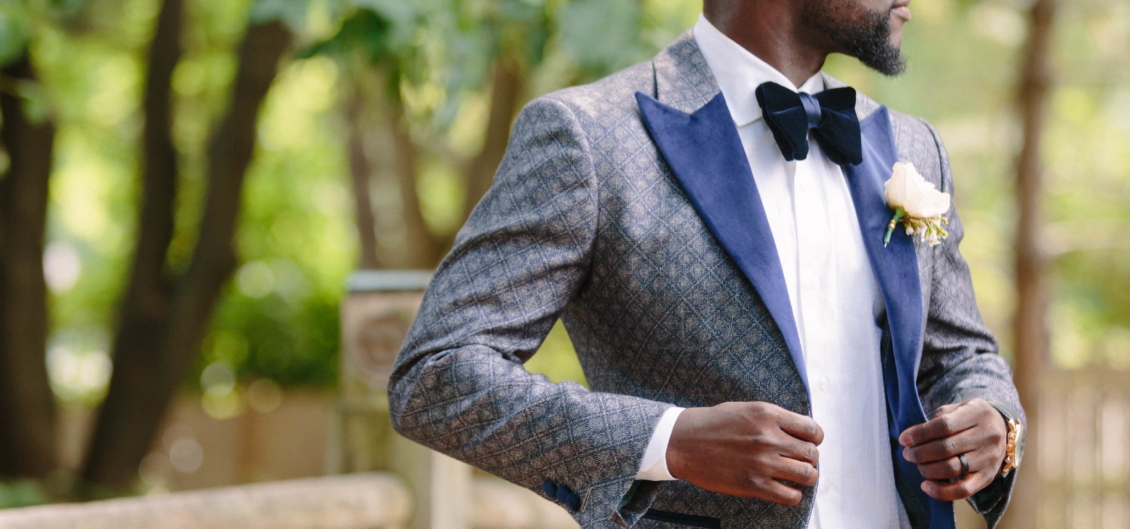 A groom wearing a custom King & Bay wedding tuxedo