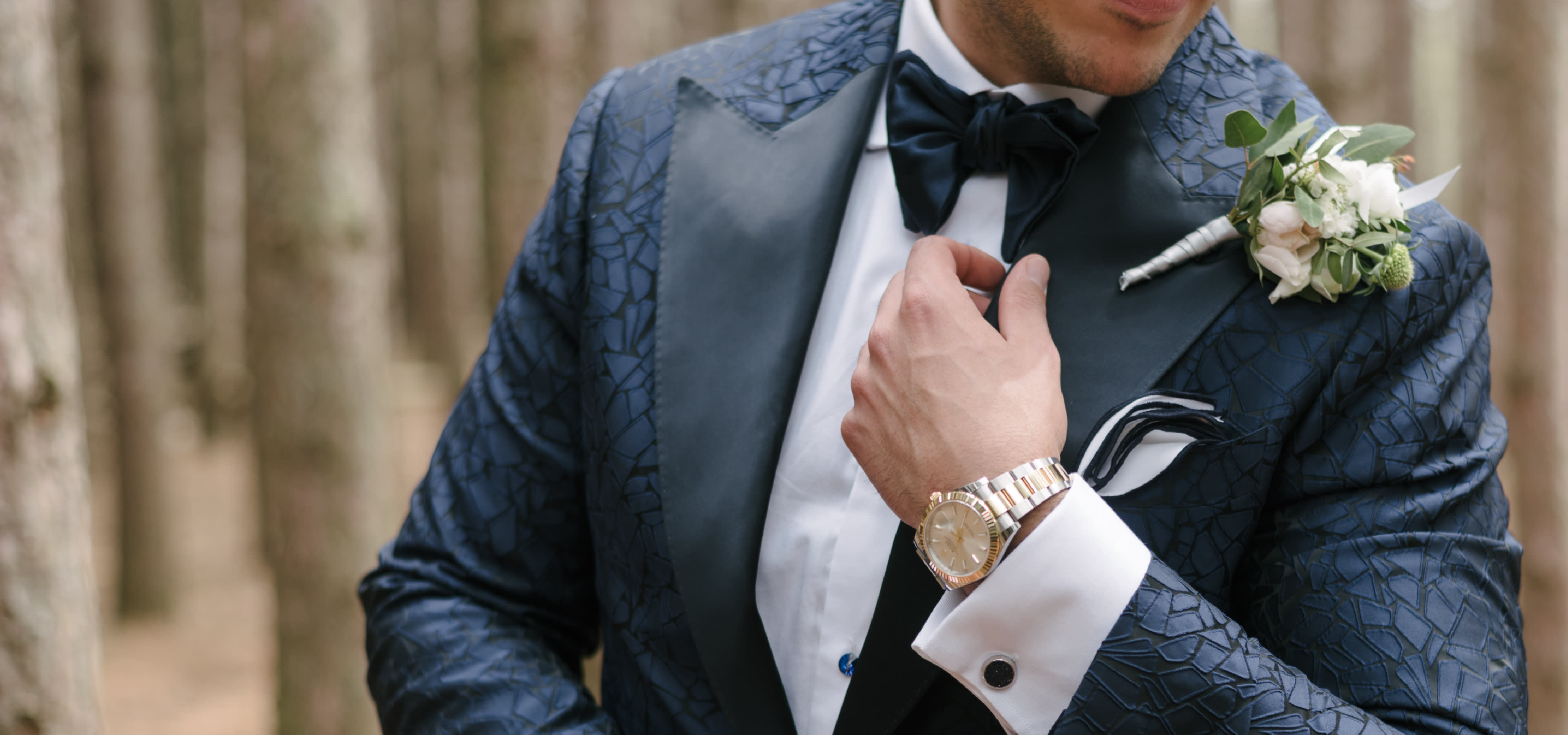 A groom wearing a custom King & Bay wedding tuxedo