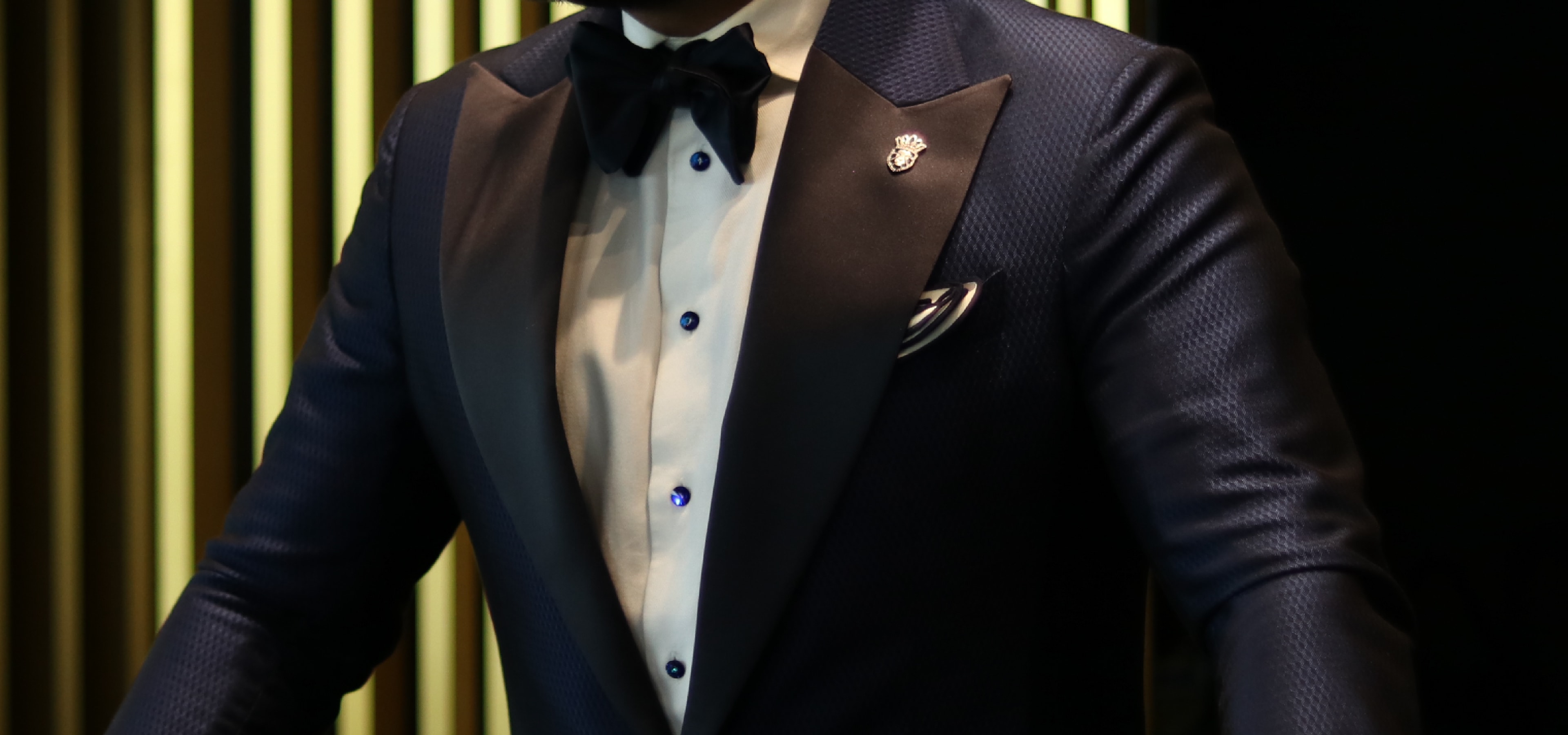 A midnight blue bespoke King & Bay tuxedo